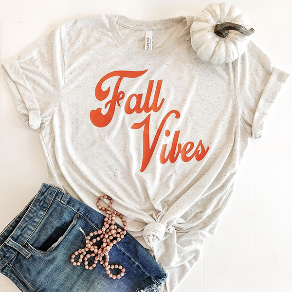 heather shirt with fall vibes logo