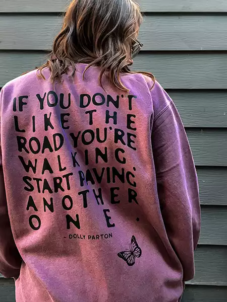 pink sweatshirt with writing